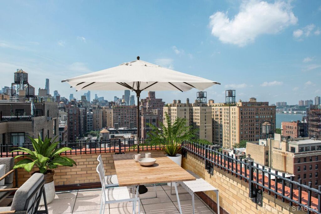 Skyline view from a balcony of an NYC apartment, another successful listing by The Zweben Team.