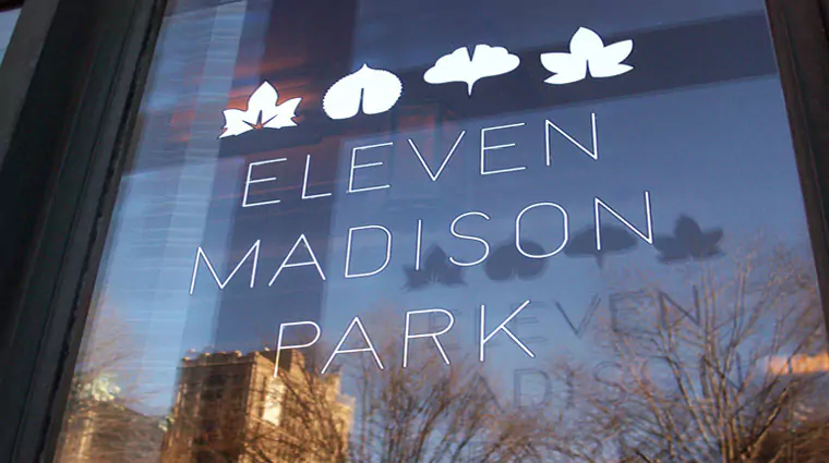 Eleven Madison Park Restaurant Signage on their Window with Logo in all white